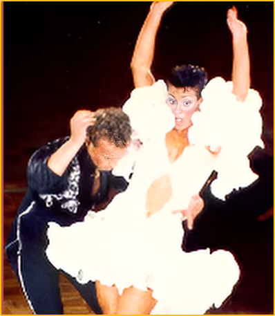 Two dancers in a cloud formation on stage.